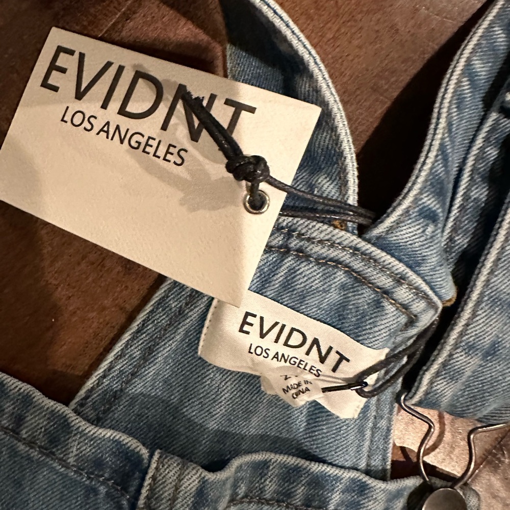 Jean overalls with fringed bottom